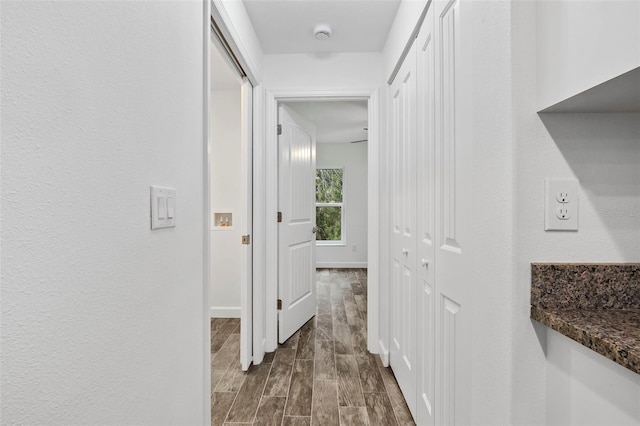 corridor featuring dark hardwood / wood-style floors