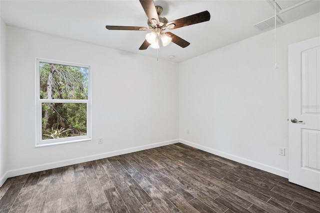 unfurnished room with ceiling fan and dark wood-type flooring