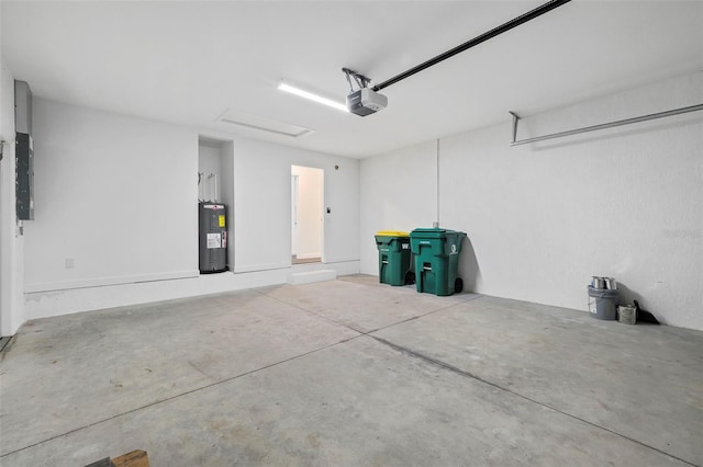 garage with a garage door opener and water heater