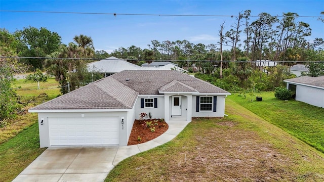 view of front of house with a garage and a front lawn