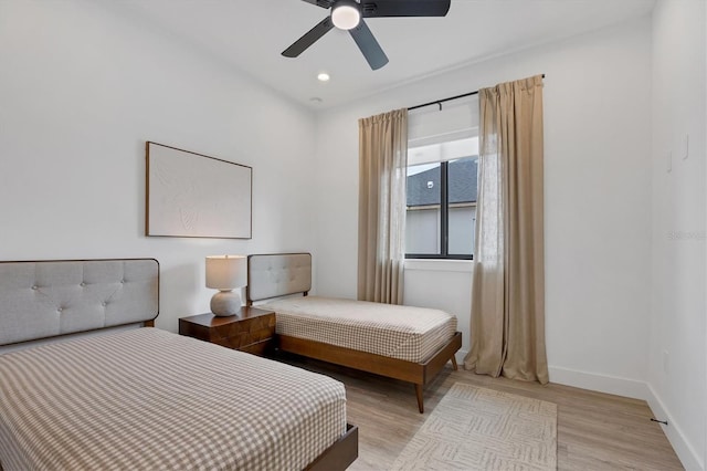 bedroom featuring ceiling fan and light wood-type flooring