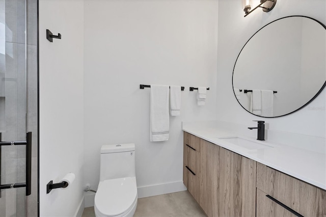 bathroom with toilet and vanity