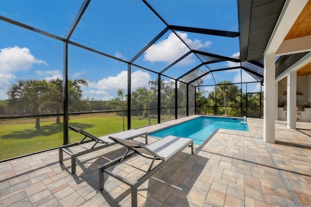 view of swimming pool with a lanai, a patio area, a yard, and area for grilling