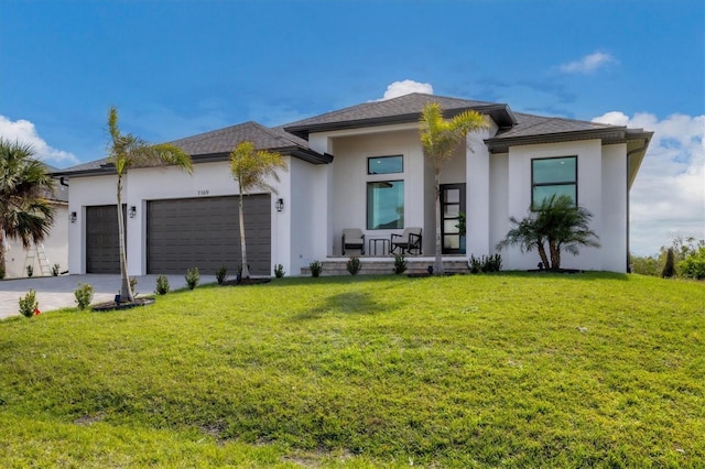 view of front facade featuring a garage and a front lawn