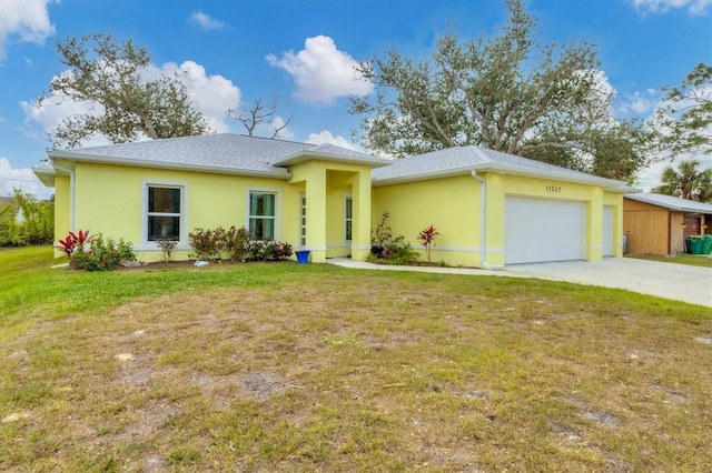 ranch-style home with a front lawn and a garage