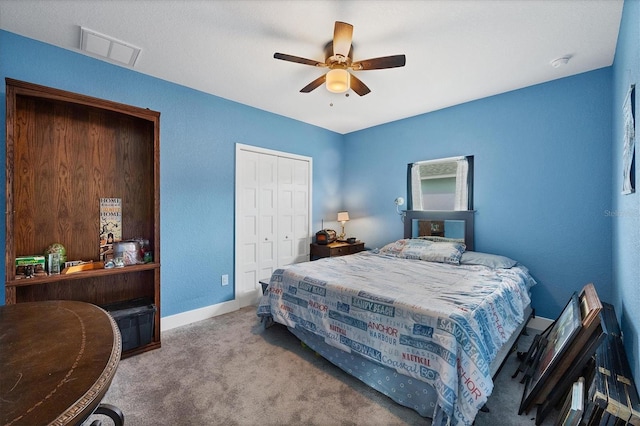 bedroom with ceiling fan, a closet, and light carpet