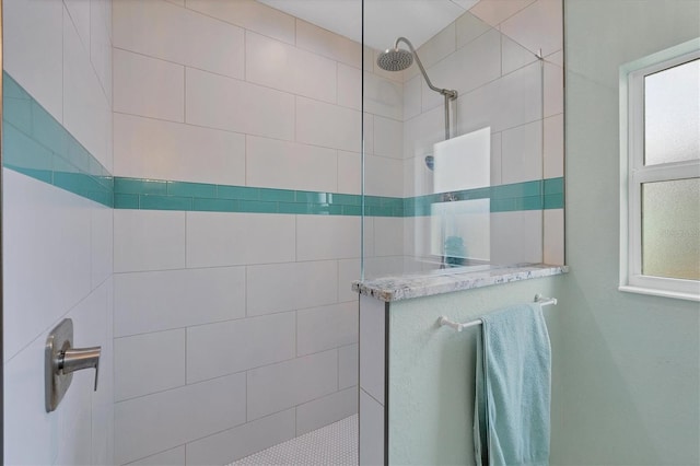 bathroom featuring a tile shower