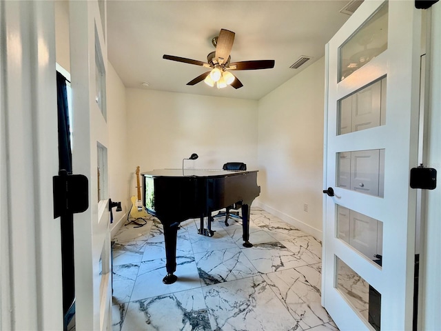 11247 Euler Ave, Englewood, FL 34224 - sitting room with light marble finish floors, baseboards, and a ceiling fan