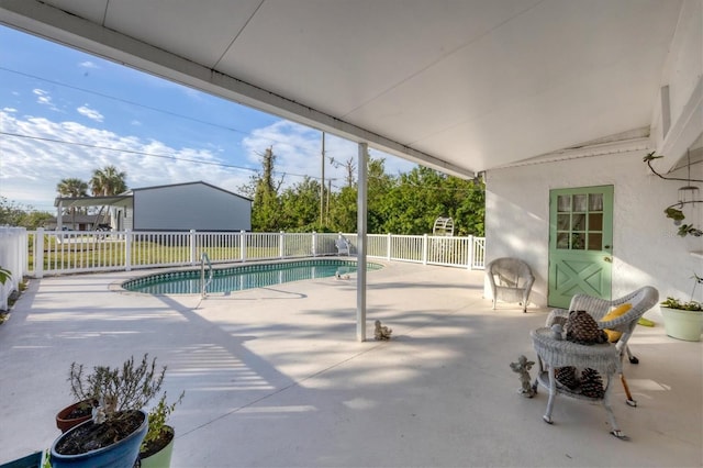 view of swimming pool with a patio