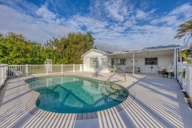 view of pool featuring a patio