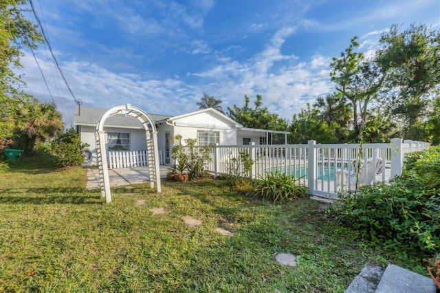 view of yard with a fenced in pool