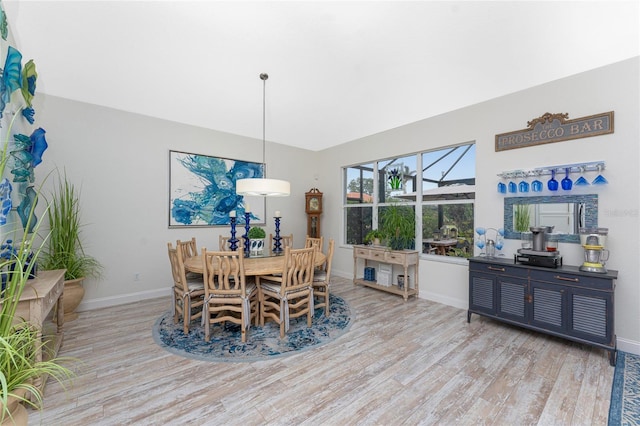 dining space featuring light wood-type flooring