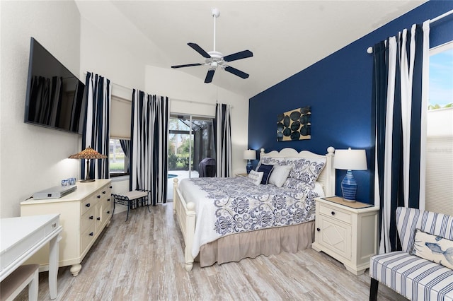 bedroom with access to outside, ceiling fan, lofted ceiling, and light wood-type flooring