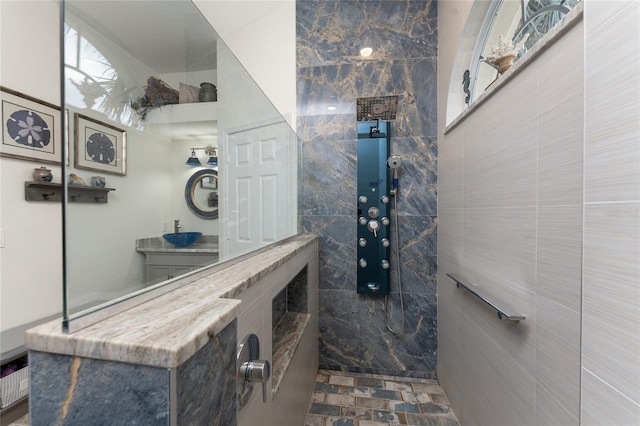 bathroom featuring a shower and tile walls