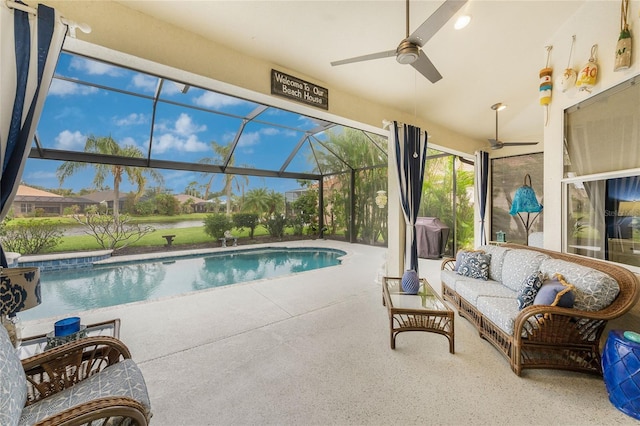 view of swimming pool with a lanai, a patio area, and outdoor lounge area