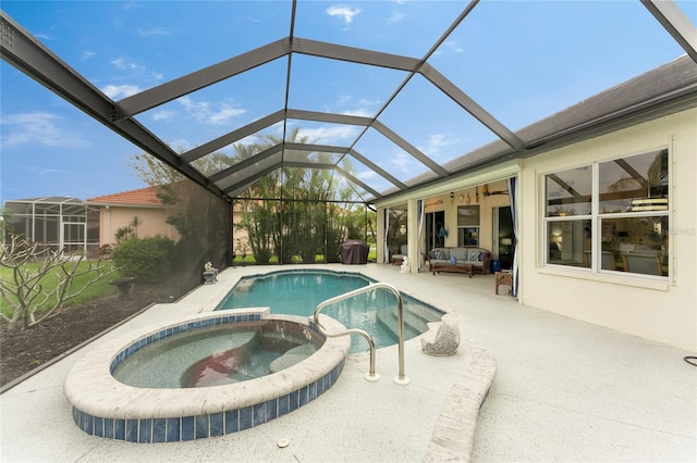 view of pool with a lanai, an outdoor hangout area, an in ground hot tub, and a patio