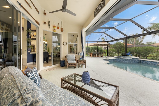 view of pool with an in ground hot tub, outdoor lounge area, a patio, and a lanai