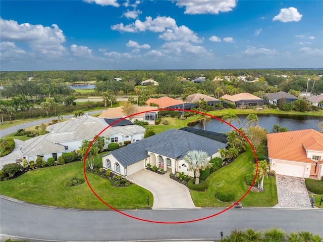 birds eye view of property with a water view