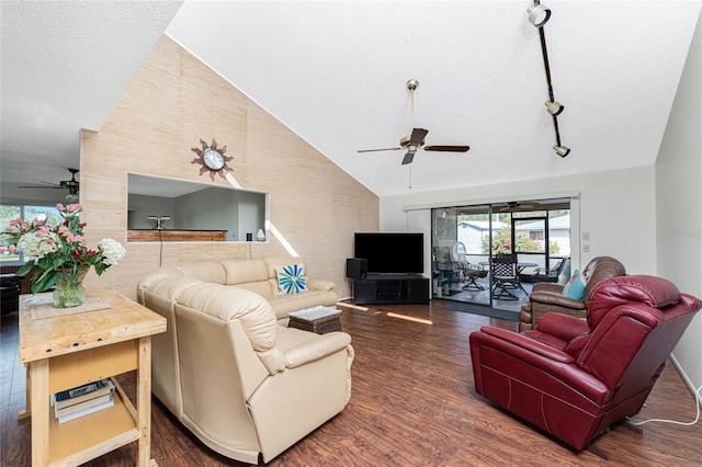 living room with ceiling fan, dark hardwood / wood-style flooring, vaulted ceiling, and a textured ceiling