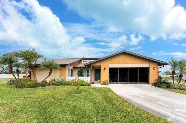 ranch-style house with a garage and a front yard