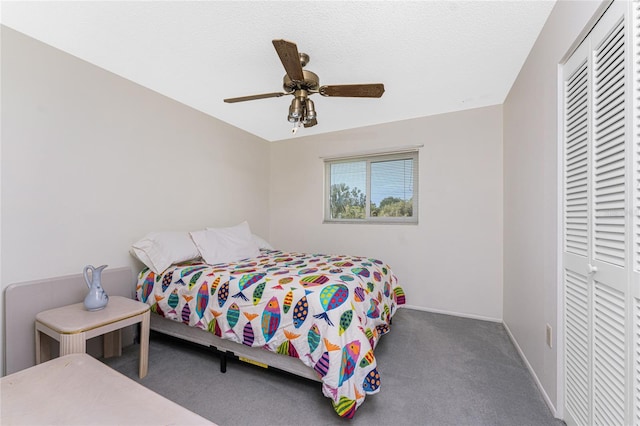 carpeted bedroom with a closet and ceiling fan