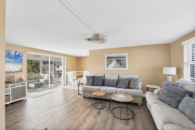 living room with light hardwood / wood-style flooring