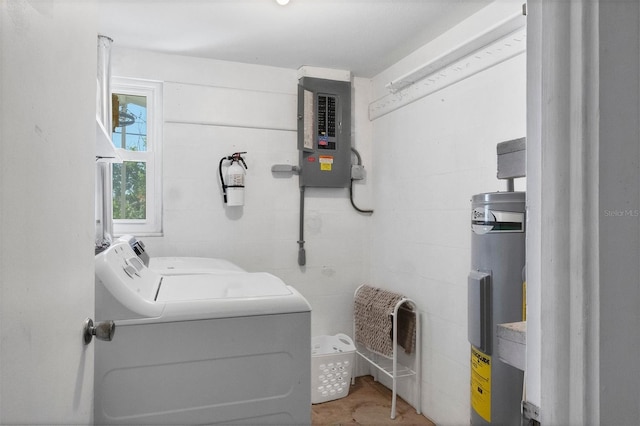 laundry area with washing machine and dryer, electric panel, and electric water heater