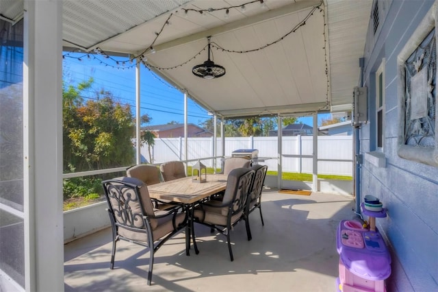 sunroom / solarium featuring vaulted ceiling