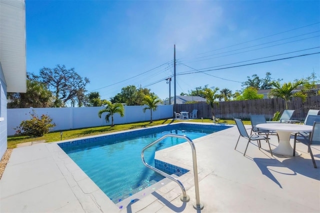 view of pool featuring a patio