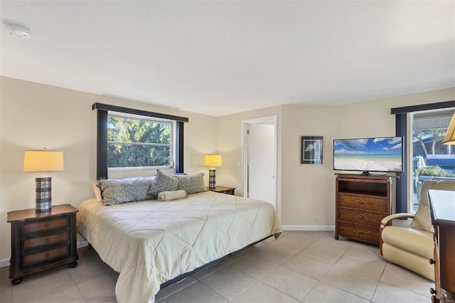 bedroom featuring light tile patterned flooring