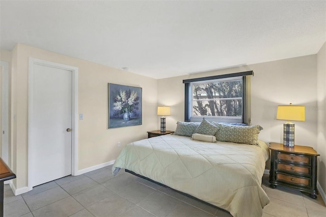 bedroom featuring light tile patterned flooring