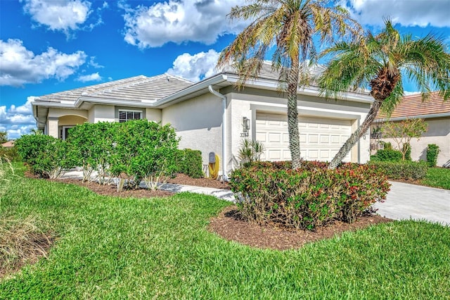 view of side of property featuring a garage and a lawn