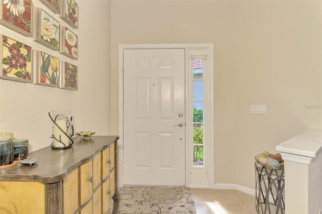 foyer entrance with light tile patterned floors