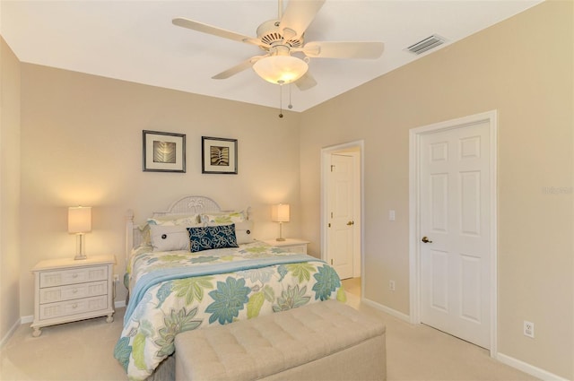 bedroom with ceiling fan and light carpet