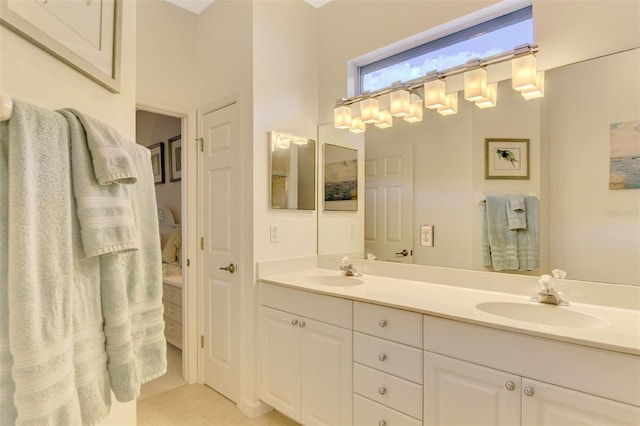 bathroom featuring tile patterned flooring and vanity