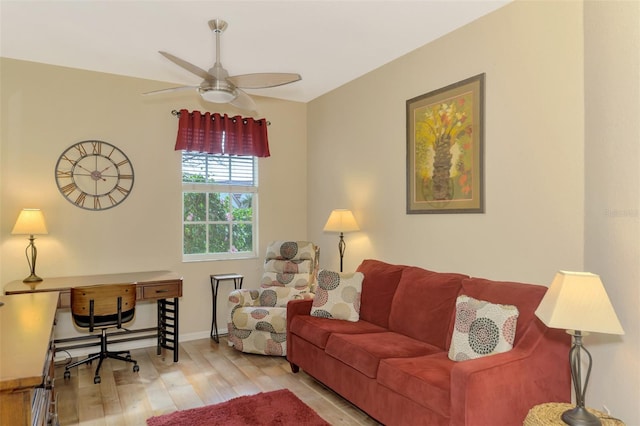 living room with ceiling fan and light hardwood / wood-style floors