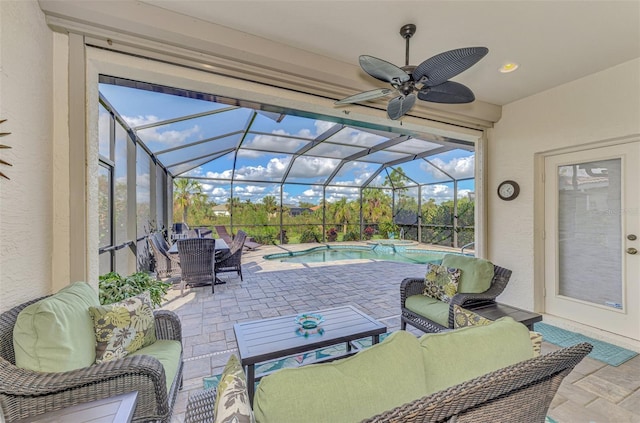 view of patio with outdoor lounge area and glass enclosure