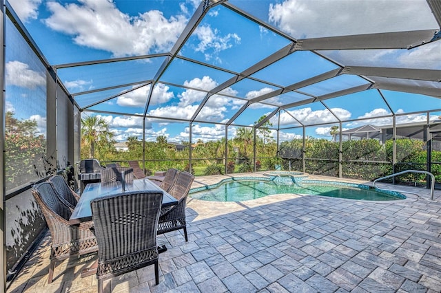 view of pool with glass enclosure, an in ground hot tub, and a patio