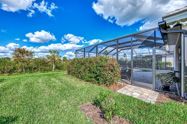 view of yard featuring a lanai