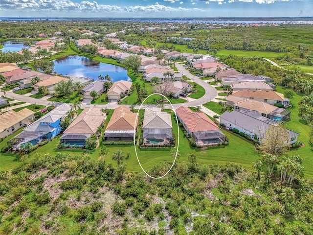 drone / aerial view with a water view