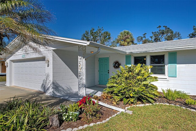 ranch-style house featuring a garage