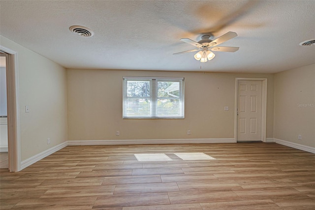 empty room featuring light wood-type flooring and ceiling fan