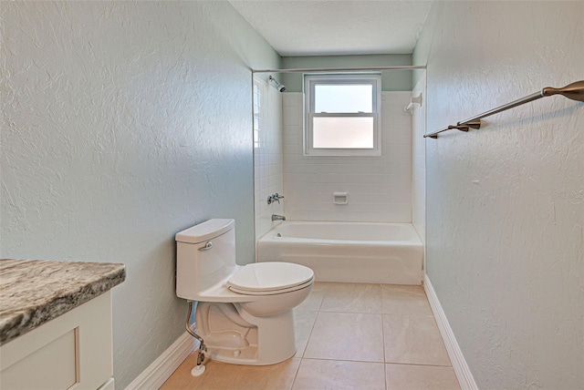 full bathroom featuring tile patterned floors, vanity, tiled shower / bath, and toilet