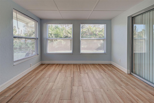 spare room with light hardwood / wood-style flooring