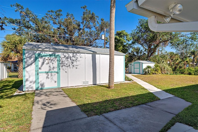 view of outbuilding featuring a lawn