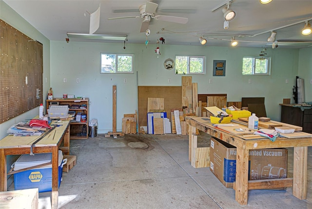 miscellaneous room with a workshop area and ceiling fan