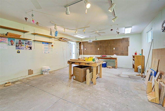 interior space featuring a workshop area and ceiling fan