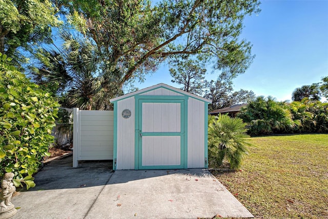 view of outdoor structure with a lawn