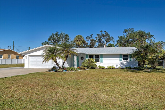 ranch-style home with a garage and a front lawn