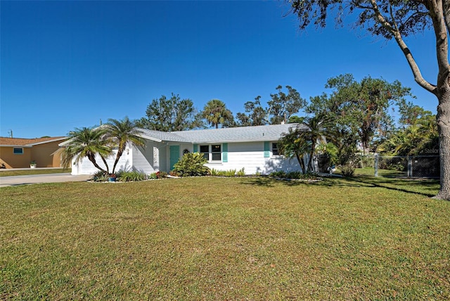 single story home with a front lawn and a garage